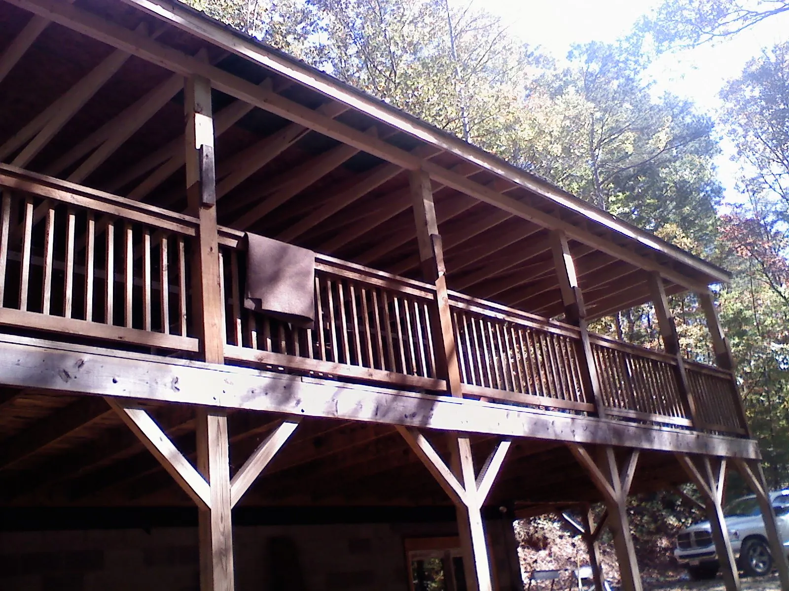 Timber framing under a new elevated porch and deck — Roof Leak Repair in Saco by Roofing Brothers
